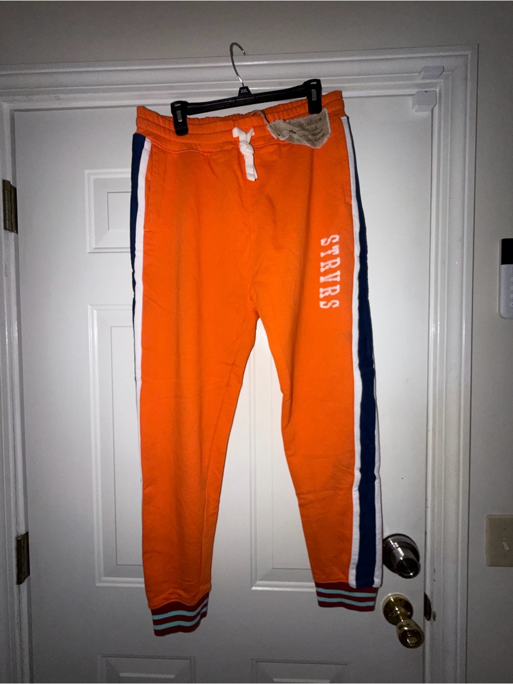 Men’s Strivers Row Stripe Jogger Pants with cuff detail. Sz L